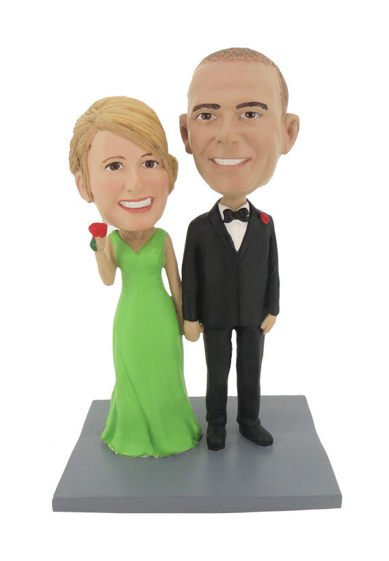 Couple Holding Hands and a Flower